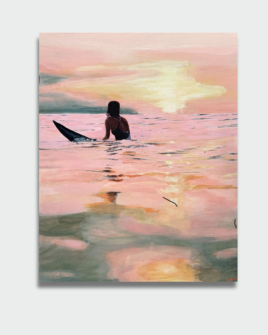 Surfing at sunset
